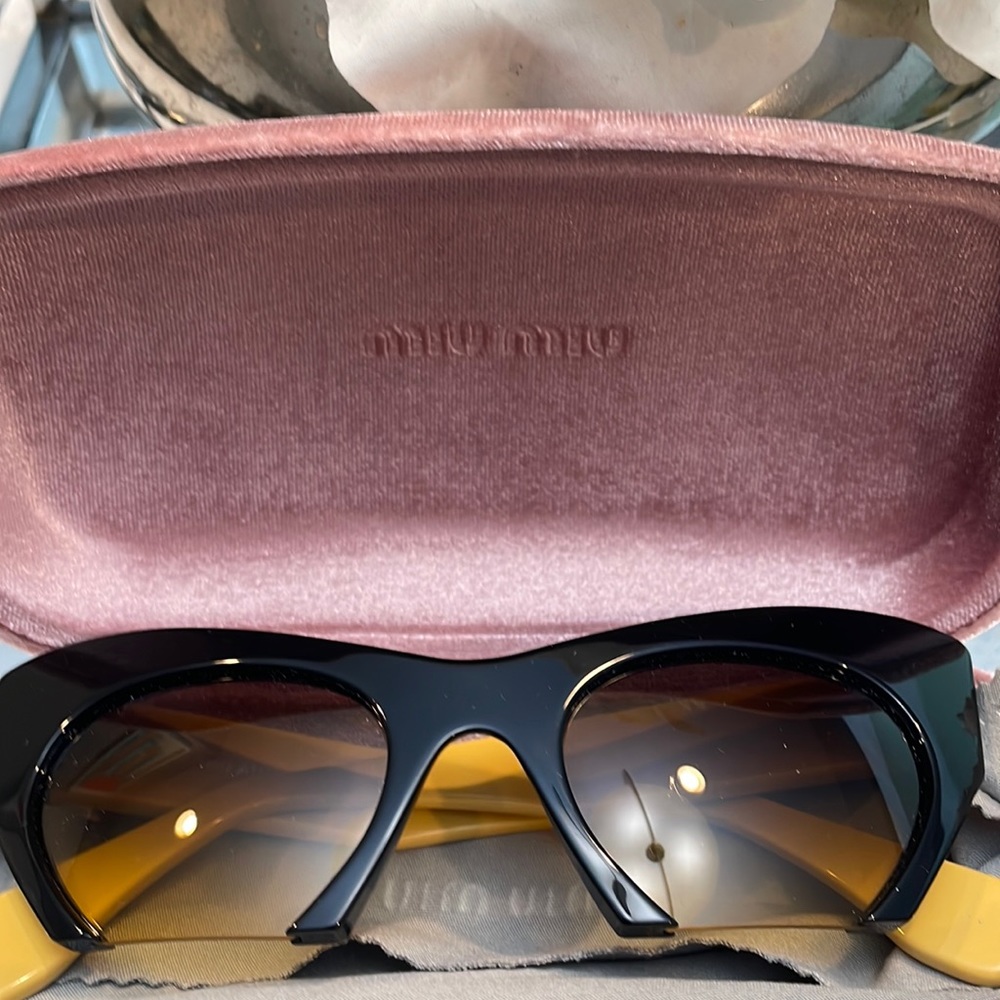 100% Authentic, never worn Miu Miu sunglasses.